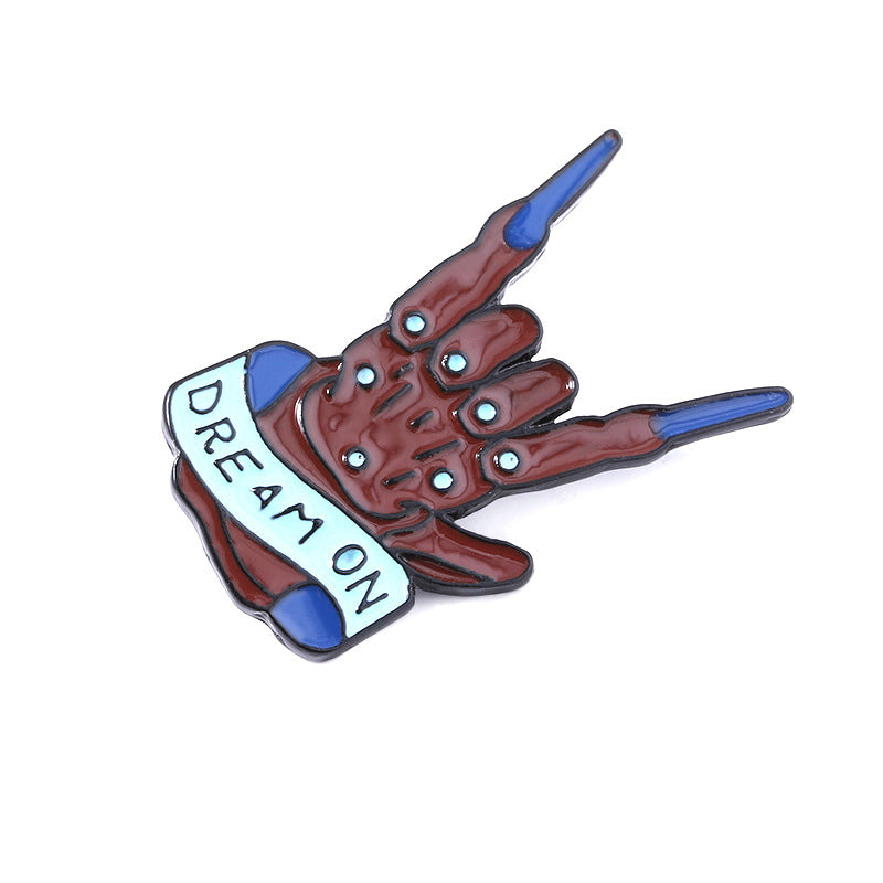 Rock band gesture brooch