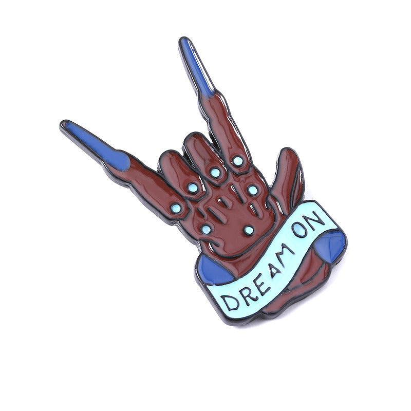 Rock band gesture brooch