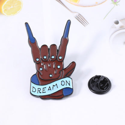 Rock band gesture brooch