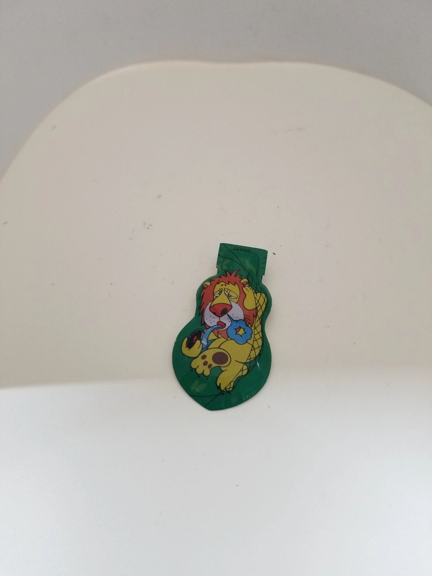 Tin Green Clicker Lion Toy