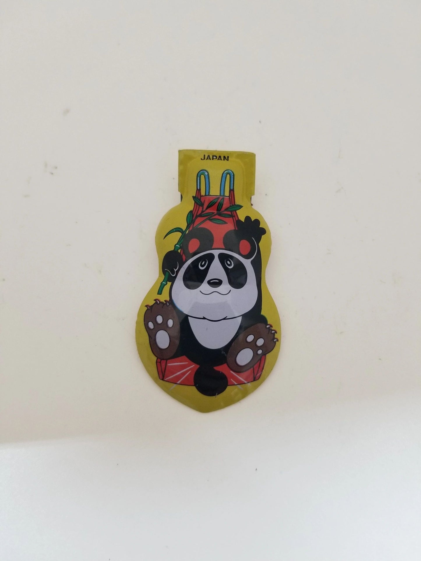 Tin Yellow Clicker Panda Toy